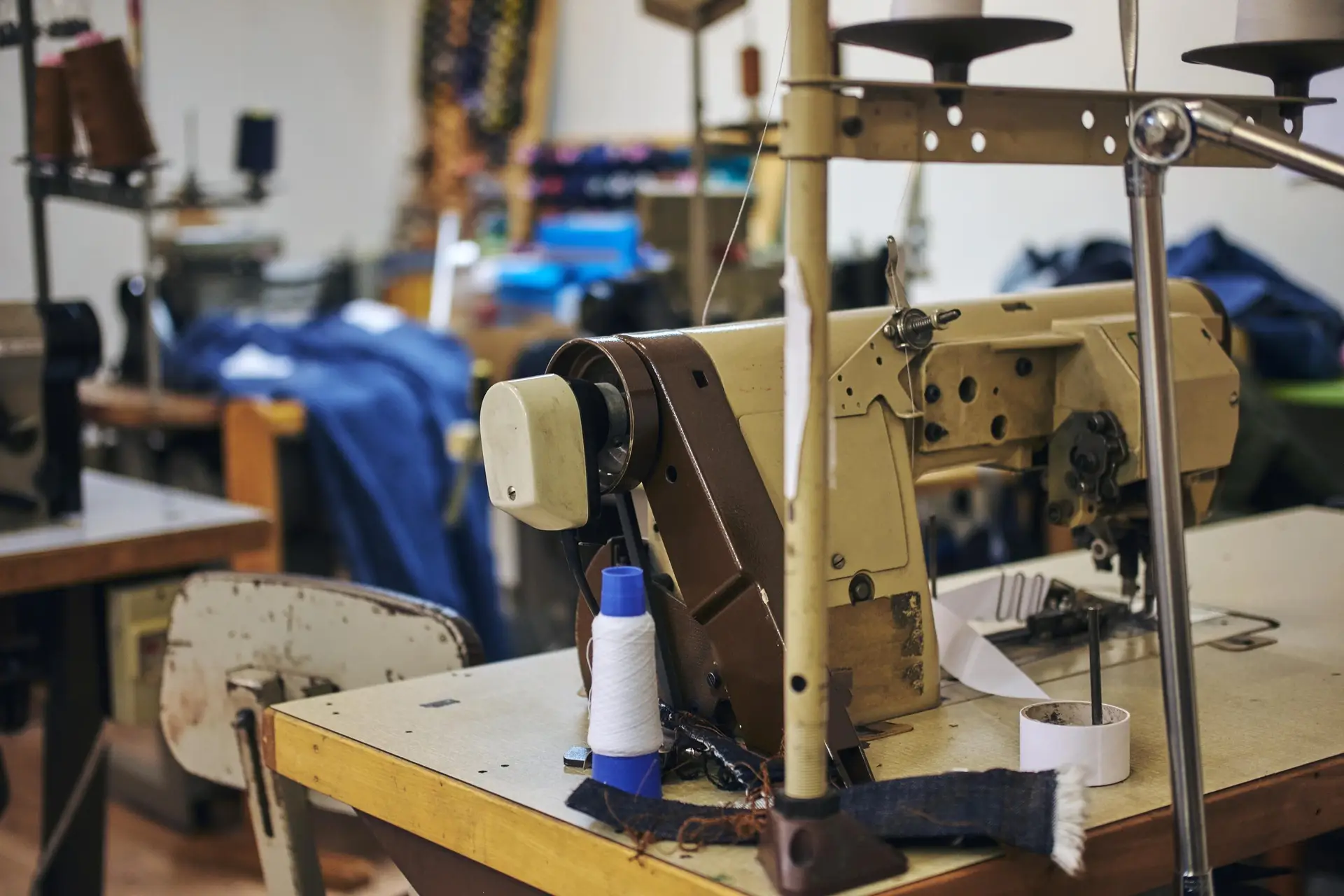 image tailor s workplace with sewing machine sewing workshop min scaled